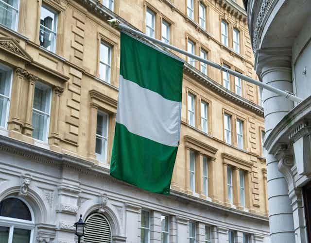 Flag flies outside a building