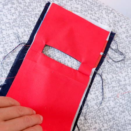 Backside of the welt pocket showing the welt fabric and the pocket opening