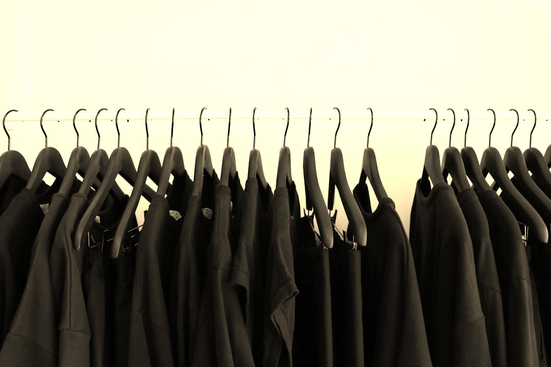 black clothes hanged in rack black clothes hanged in rack