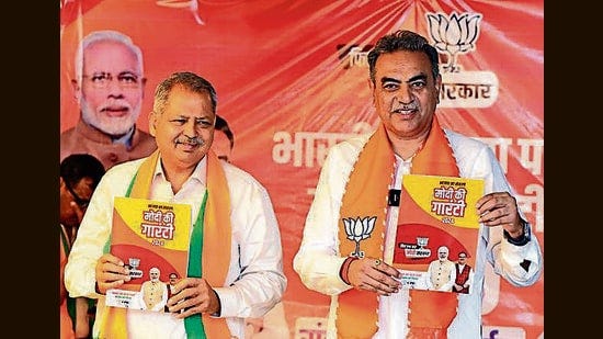 Chandigarh BJP candidate Sanjay Tandon and local party chief Jatinder Pal Malhotra launching the party manifesto at a hotel in Sector 43 on Thursday. (Keshav Singh/HT)