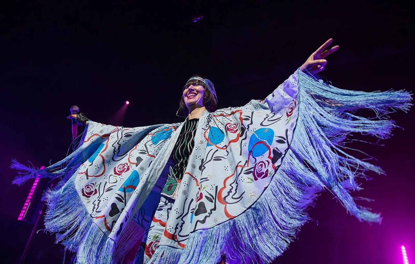 Karen O onstage in a huge abstract cape thing with a ton of fringe. Ethereal.