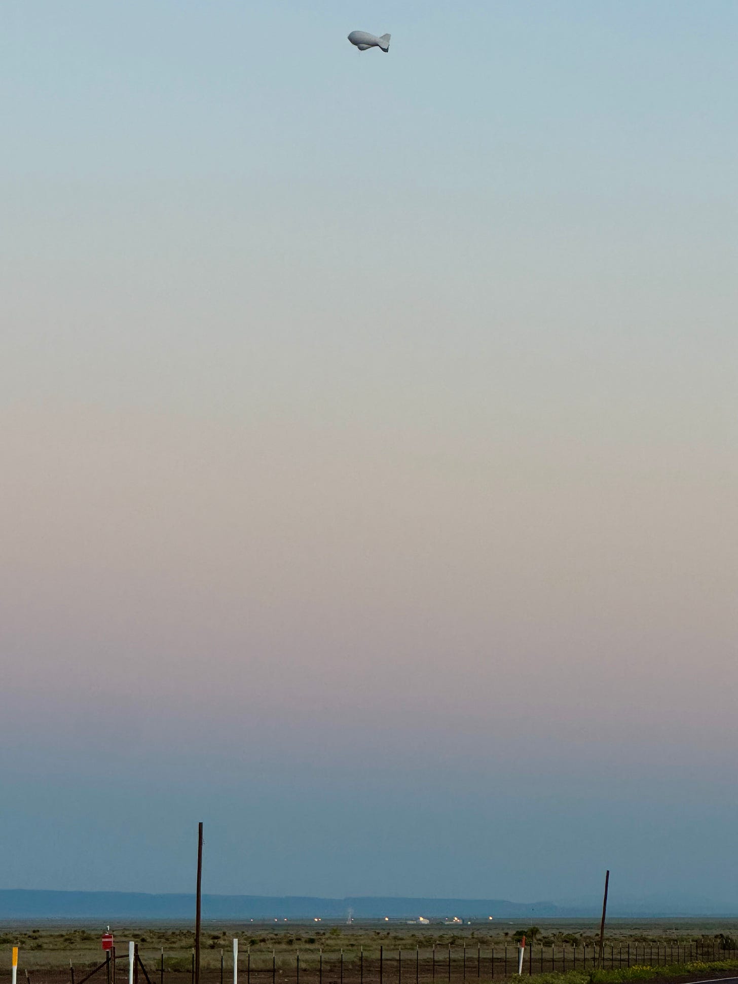 Tethered Aerostat above its Border Patrol base, West Texas