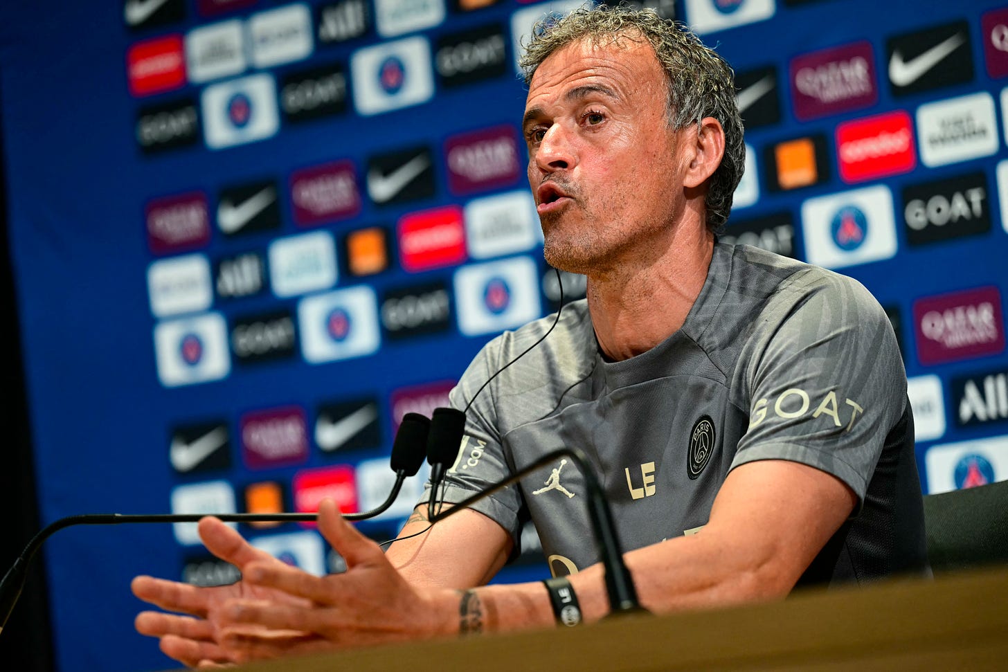 Luis Enrique pictured speaking at a PSG press conference in May 2024
