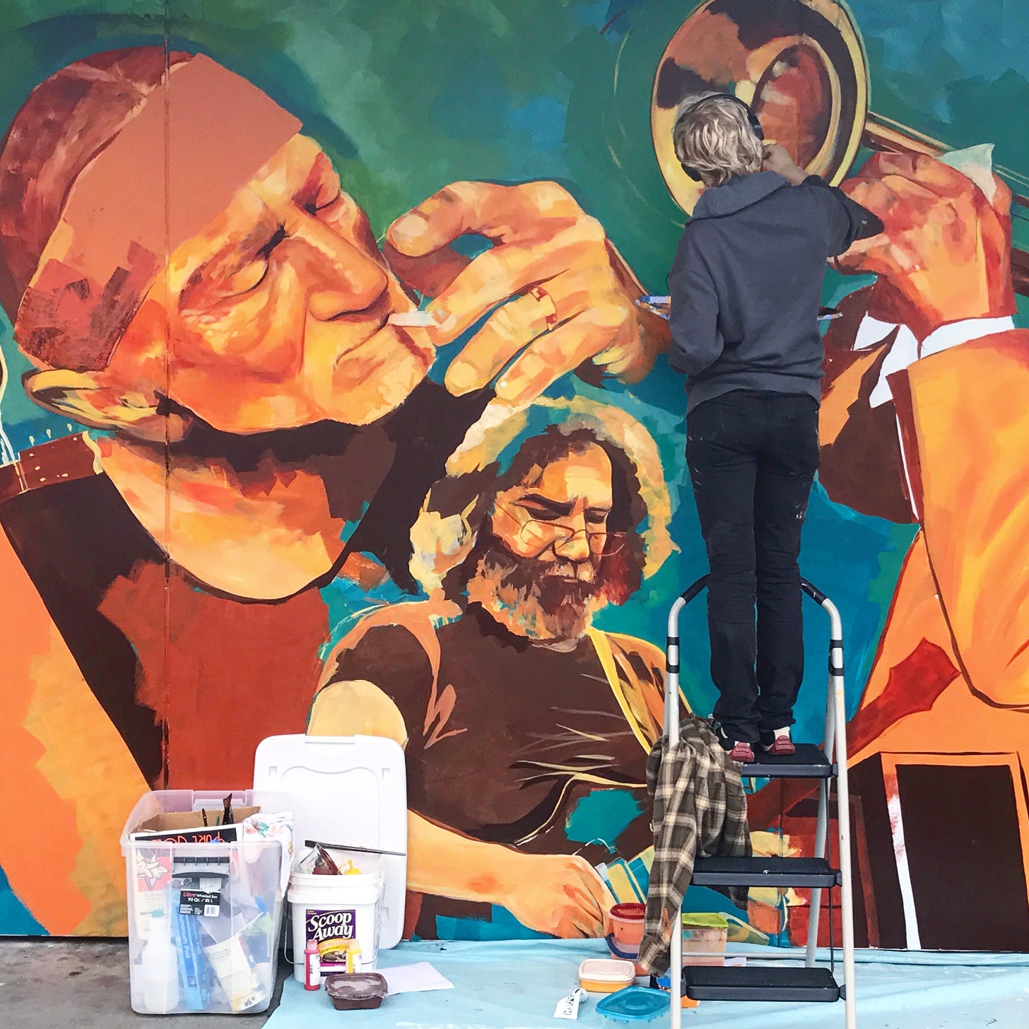 Photo of a mural painter by Dylan Mullins on unsplash.