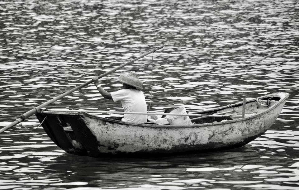 A person in a small fishing boat