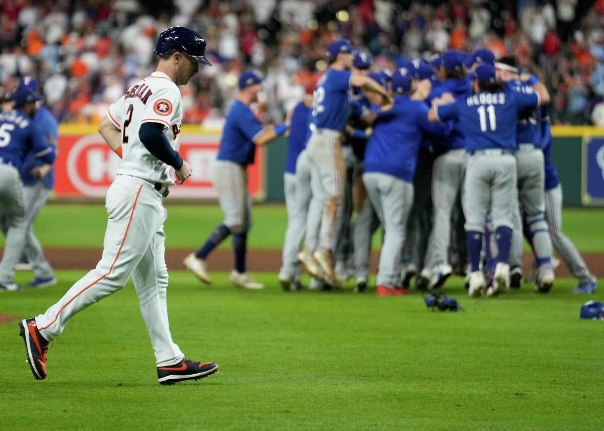 Houston Astros Alex Bregman jogs back to the dugout after the Texas Rangers defeated the Astros 11-4 in Game 7 of the American League Championship Series at Minute Maid Park on Monday, Oct. 23, 2023, in Houston.