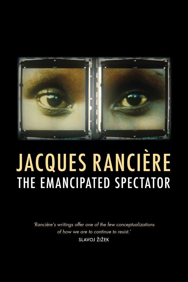 The cover of Jacques Rancière’s The Emancipated Spectator. The cover has a stark black background and features a cropped photograph of two eyes surrounded by strange, square metal frames. 
