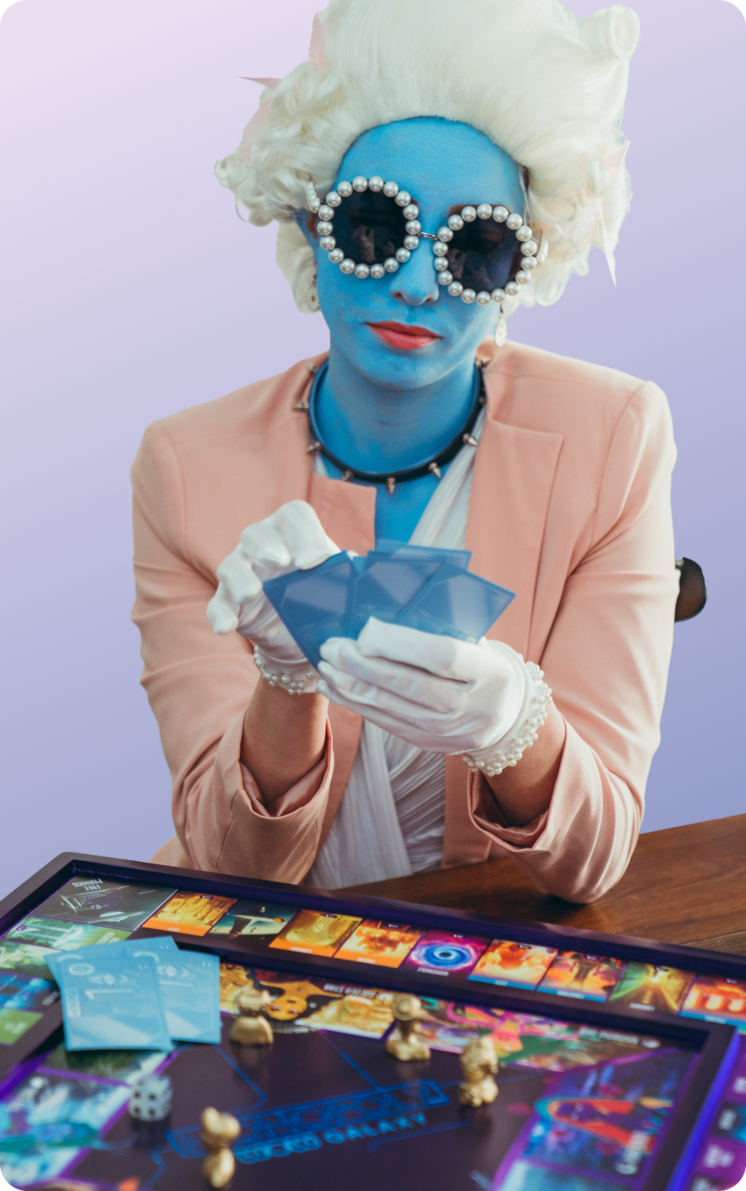 Blue woman playing Monopoly