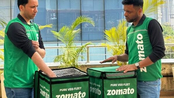 Deepinder Goyal shared a picture of himself and Zomato food delivery CEO Rakesh Ranjan wearing the green jacket worn by delivery agents of Zomato’s newly launched Pure Veg Fleet. 