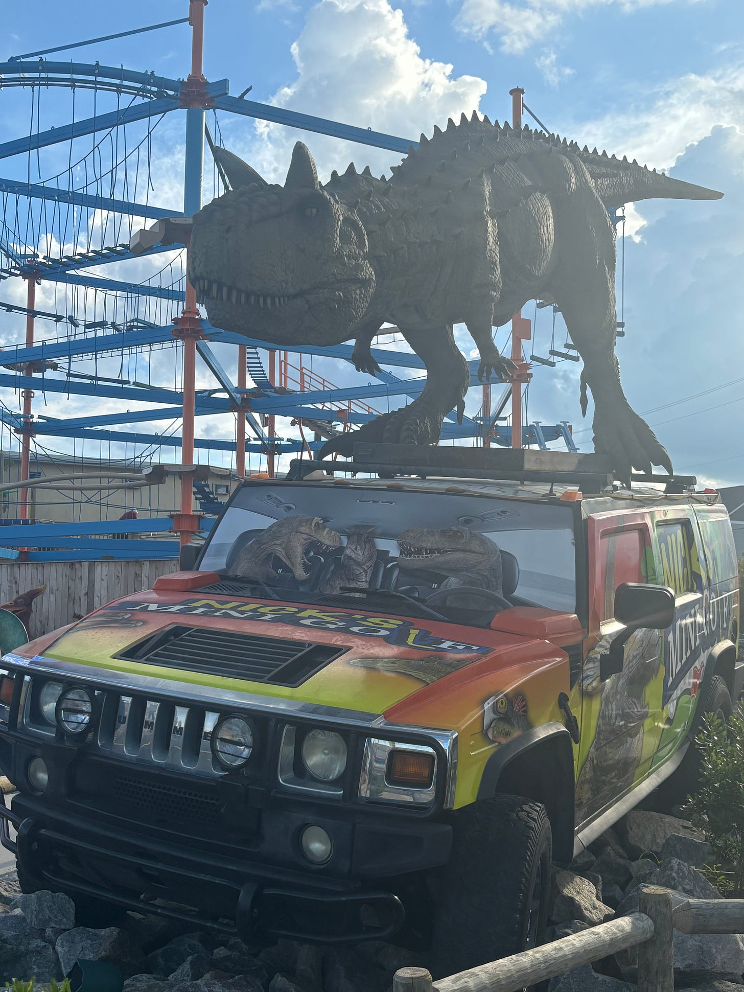 A T-Rex standing on a truck that was the centerpiece of a very amusing mini-golf course in Ocean City, MD