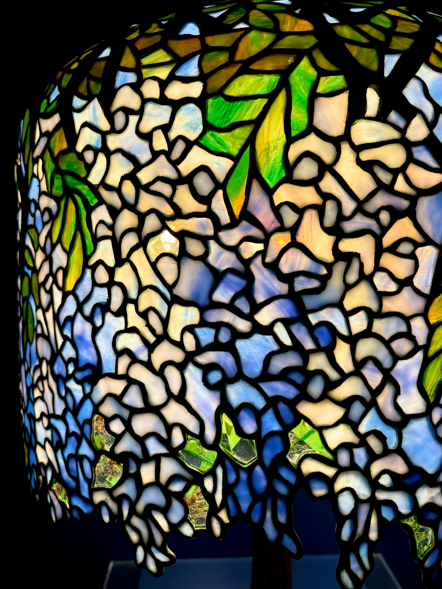 A close up of the wisteria lampshade, the glass tiles and lead linking them.