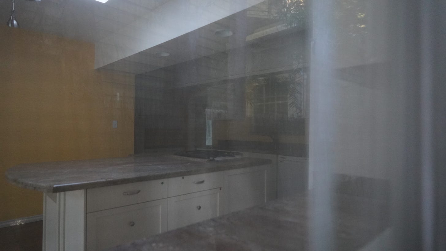 An empty kitchen in an abandoned house to communicate loss