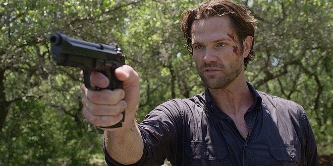 Walker Jared Padalecki looking fierce as he points gun at Stan.