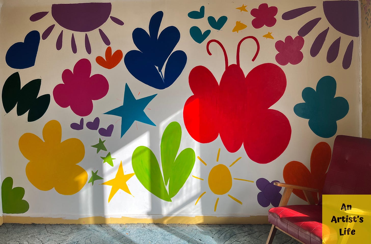 A white mural with colourful symbols