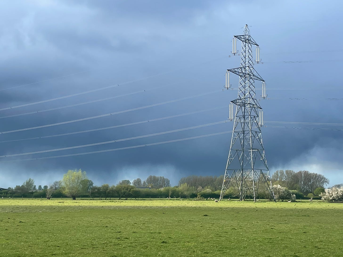 Dark clouds behind a power line