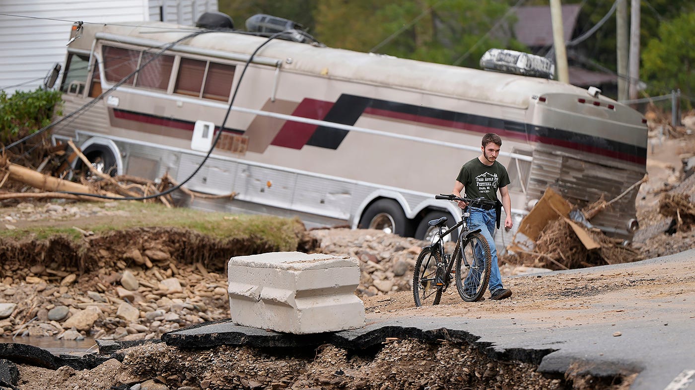 Dominick Gucciardo walks to his home in the aftermath of Hurricane Helene