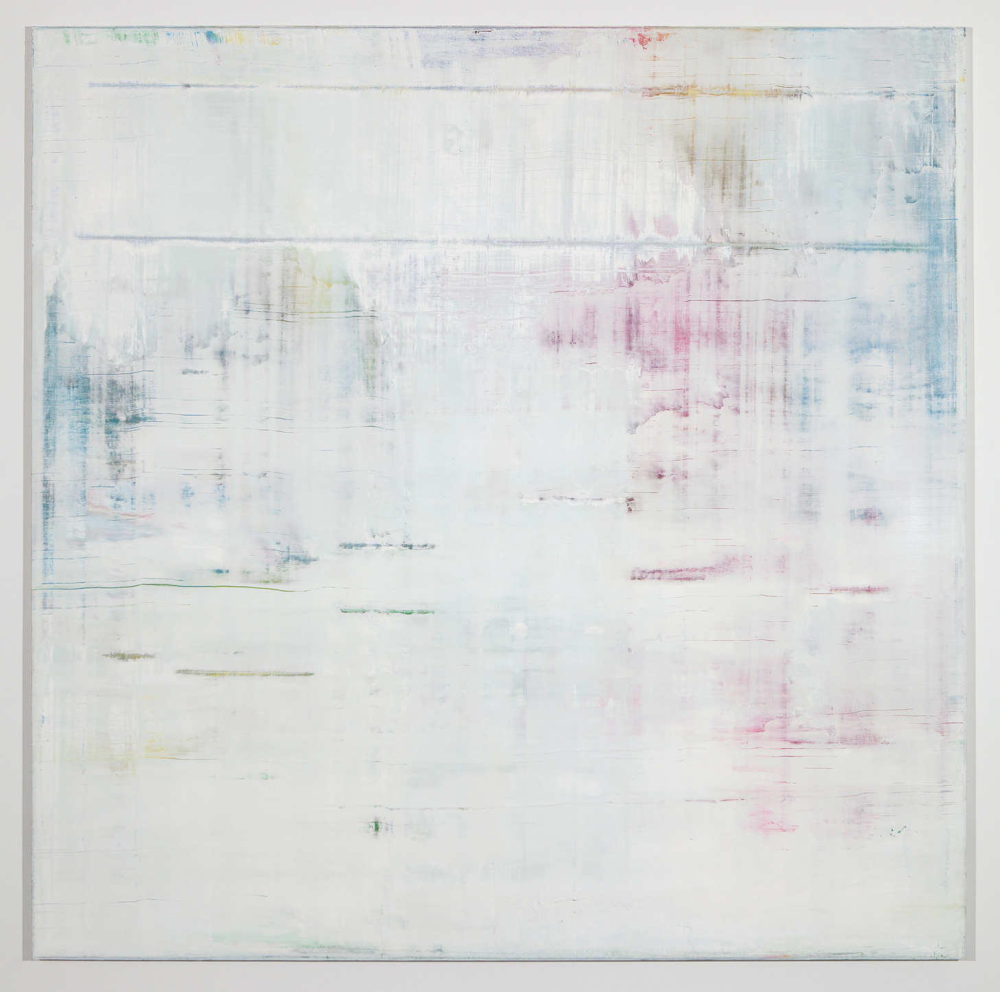 A painting by Gerhard Richter: It shows an almost entirely white square canvas, on which there are faint, perpendicular streaks of turquoise, pink and yellow paint running horizontally and vertically across. It appears as thought the colorful streaks were covered with additional layers of white paint. The painting possesses a quality of tranquility and spaciousness within in. 