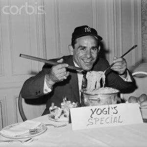 Yogi Berra Digging into Pot of Spaghetti