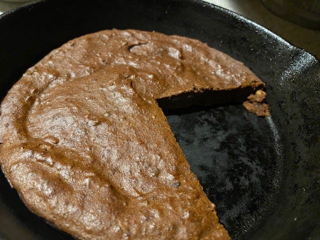 pan of black bean brownies with a slice cut out