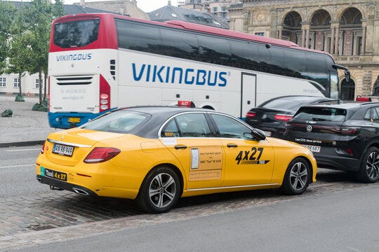 Copenhagen, Denmark - July 26, 2022: Yellow Mercedes taxi in Copenhagen.  Stock Photo | Adobe Stock