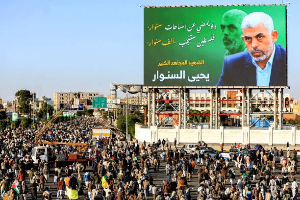 Billboard depicting Hamas' slain leader Yahya Sinwar with the Arabic slogan "if Sinwar departs from the battlefields, Palestine will birth a thousand...