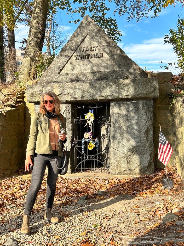 A person standing in front of a grave

Description automatically generated