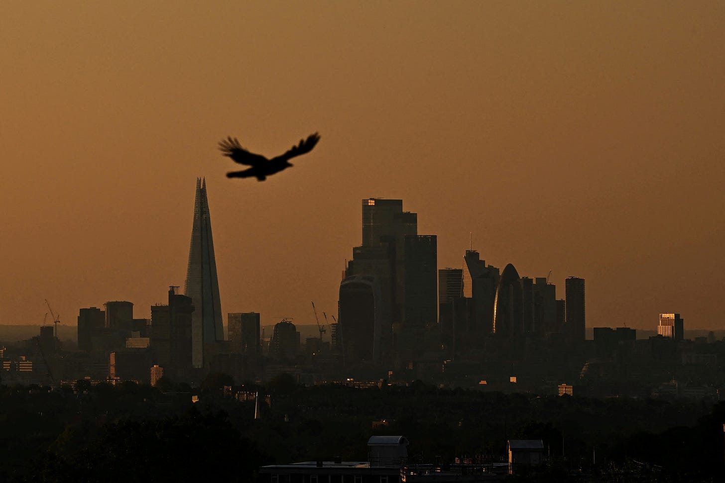 The sun sets over the capital's skyline as warm temperatures, trigger a ‘high’ alert for air pollution, in London