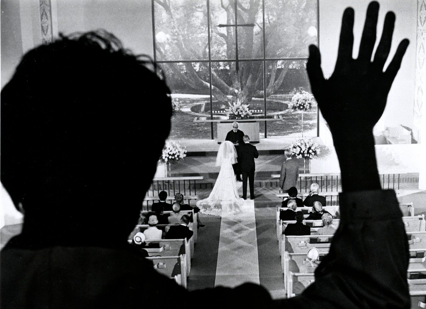 An image from the Graduate of Benjamin looking down at Elaine’s wedding