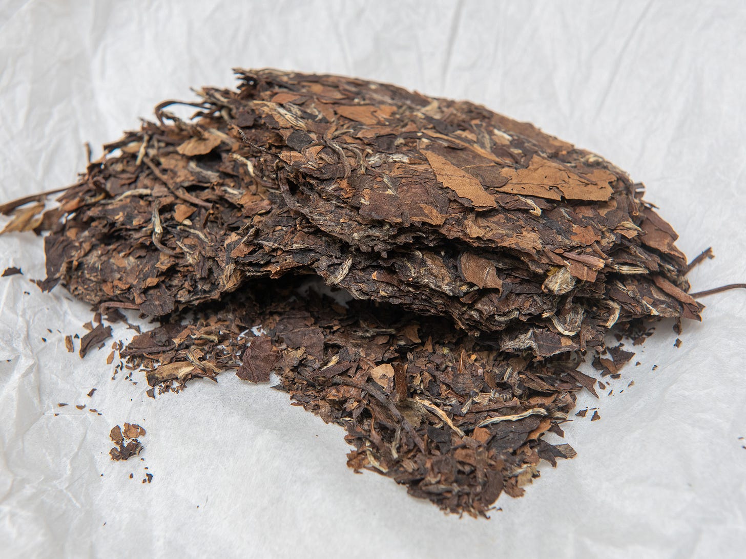 ID: Cake of gong mei white tea, about one third remaining