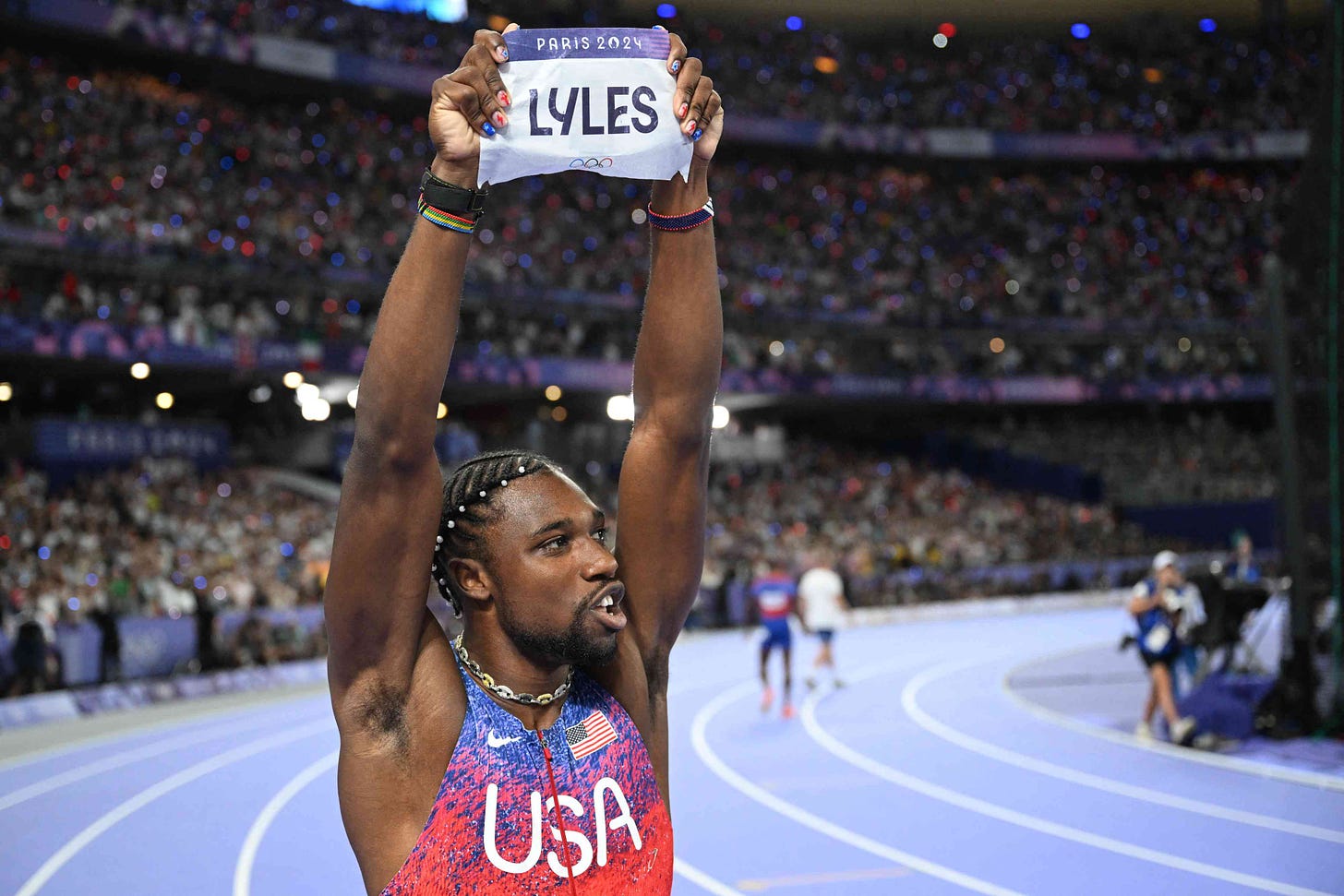 US' Noah Lyles celebrates after winning the men's 100m final of the athletics event at the Paris 2024 Olympic Games at Stade de France in Saint-Denis, north of Paris, on August 4, 2024.