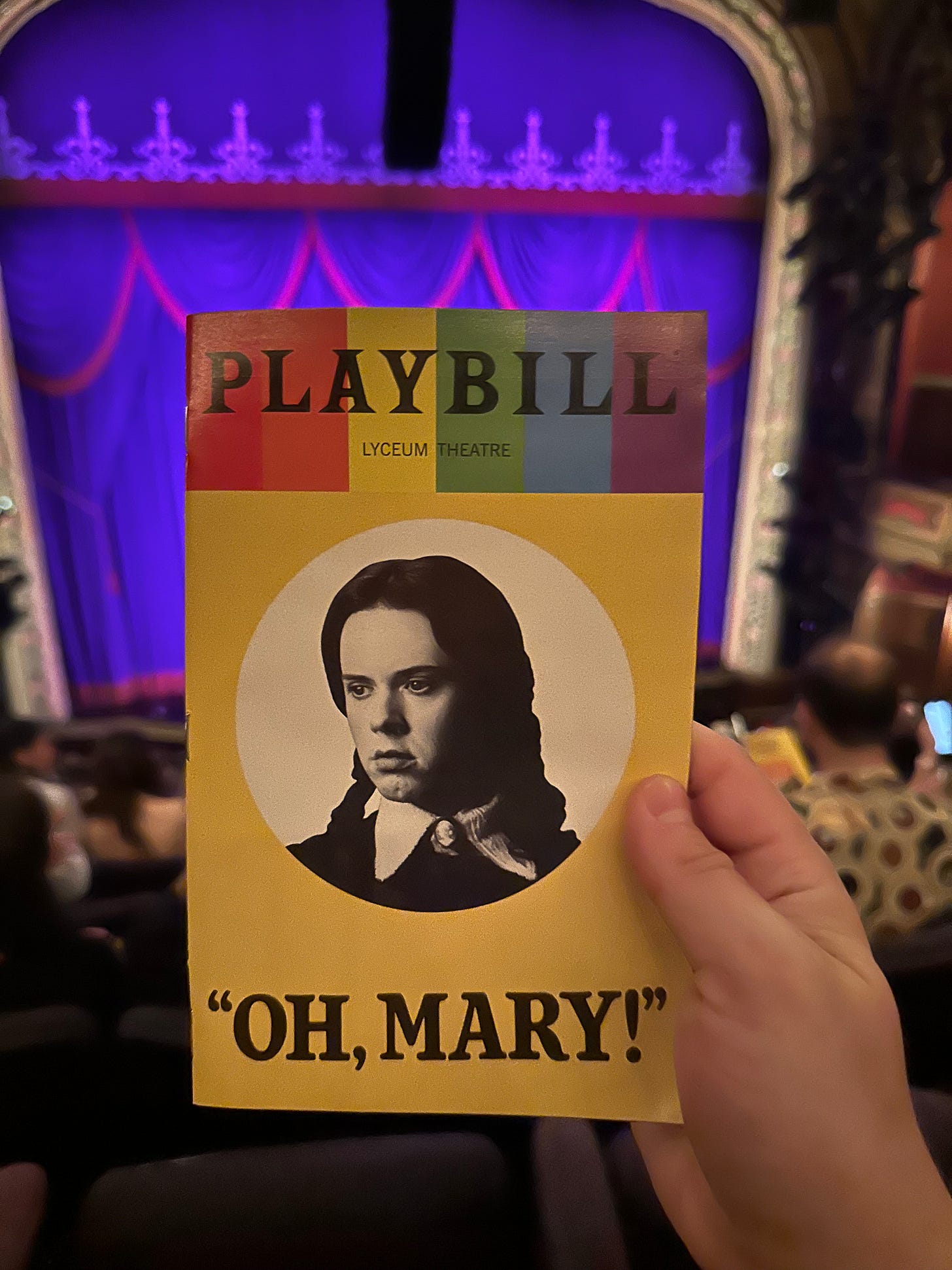 The Oh, Mary program in my hand with the curtain of the Lyceum Theater in the background.