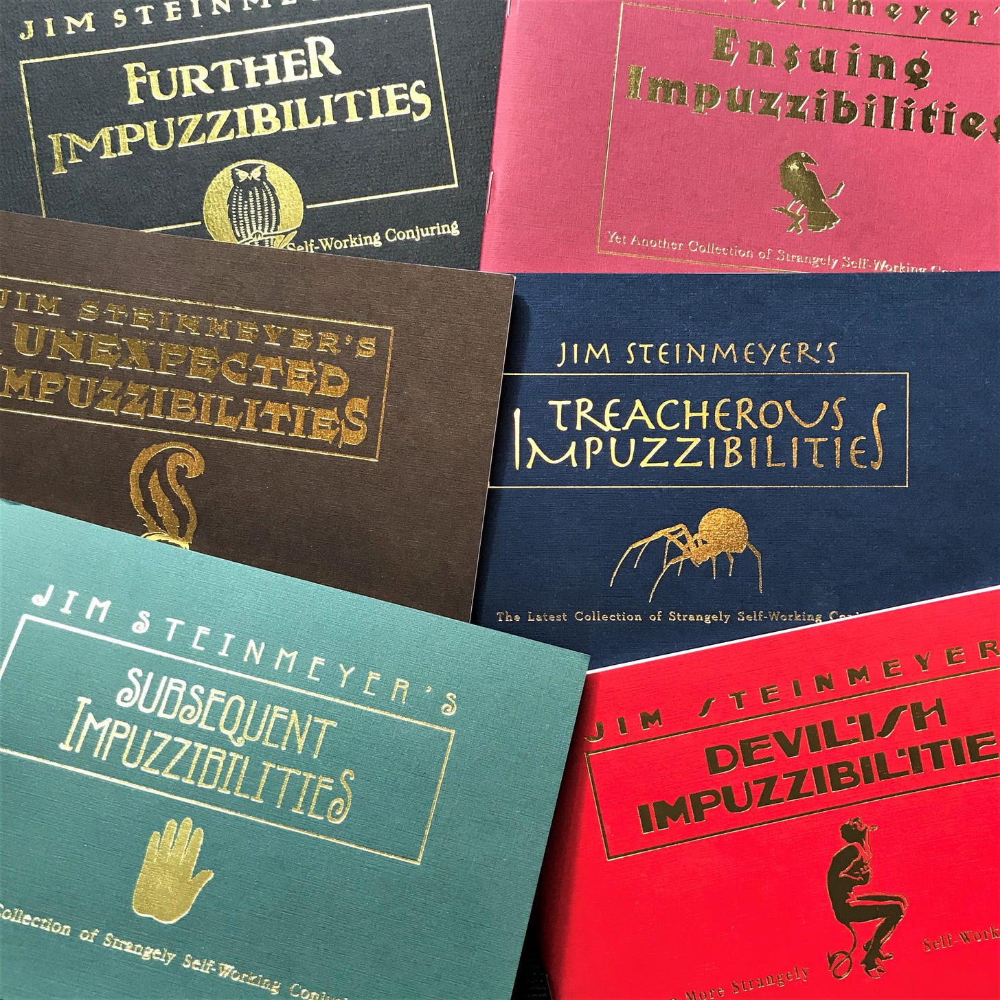 Six colourful books from the Impuzzibilities series by Jim Steinmeyer.