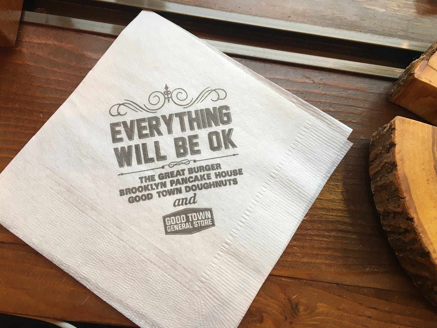 A napkin with 'Everything will be okay' printed on it.