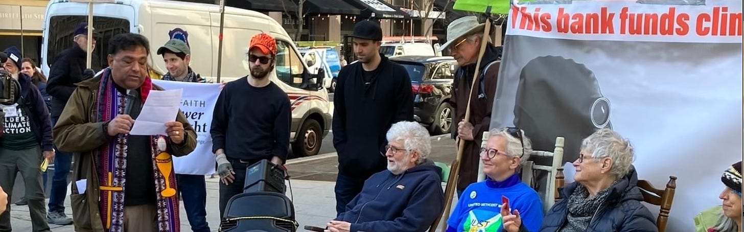 protesters in New York with signs and reading statement.