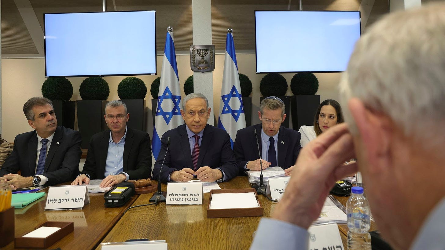 Israeli Prime Minister Benjamin Netanyahu (center) attends a weekly cabinet meeting in Tel Aviv. 