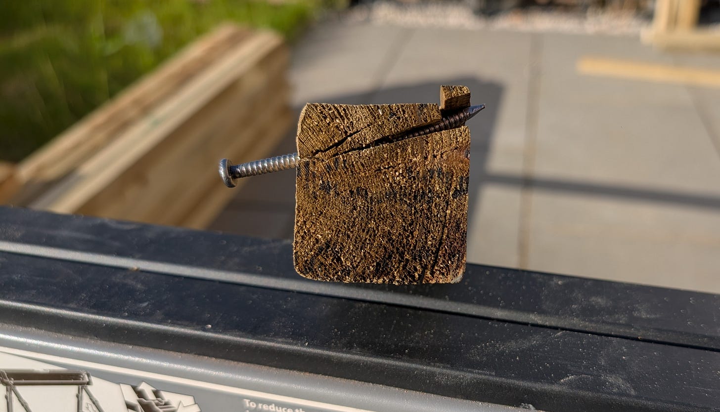 Wood split by an improperly placed nail during shed base construction