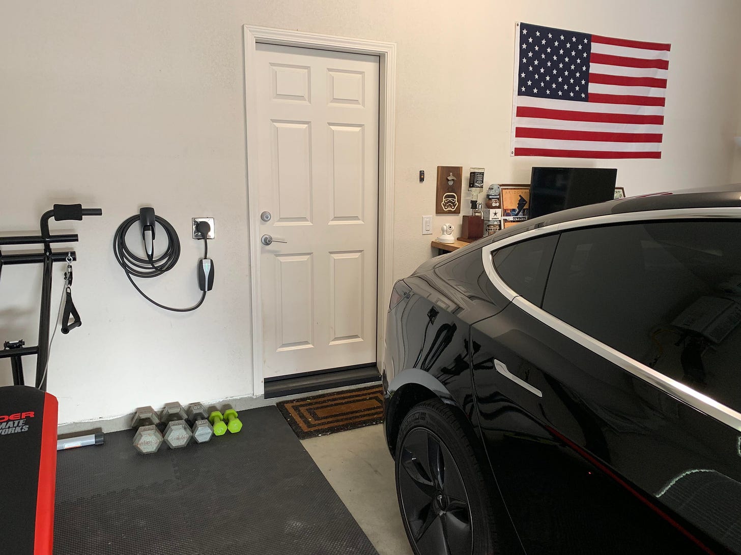 Found out our new construction home came pre-wired for 240v EV charging at  30mph. Conveniently placed wiring next to the door = $12 Lowe's trip to get  up and charging 😏🔌⚡️ : r/teslamotors