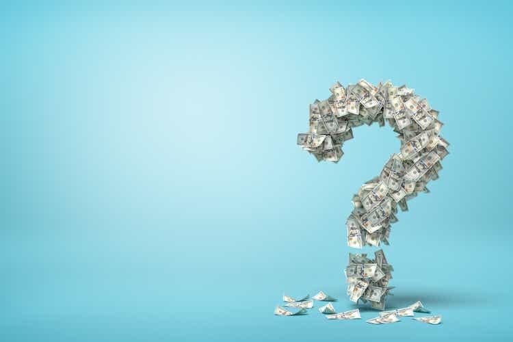 3d rendering of question mark made up of dollar banknotes on blue background.