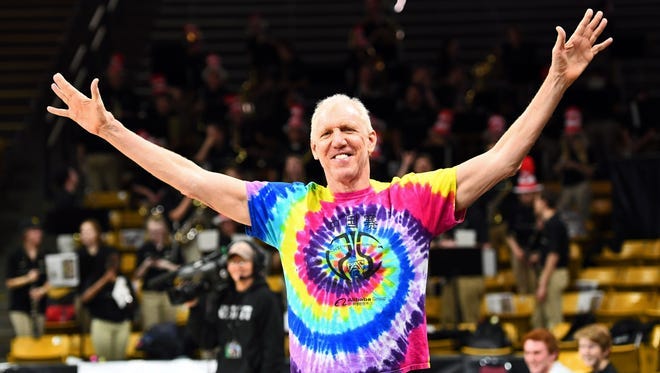 Broadcaster Bill Walton gestures to the crowd before a game between Stanford and Colorado at the Coors Events Center.