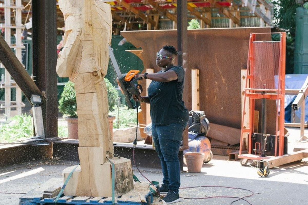 A Photo of Leilah Babirye working on a sculpture project.