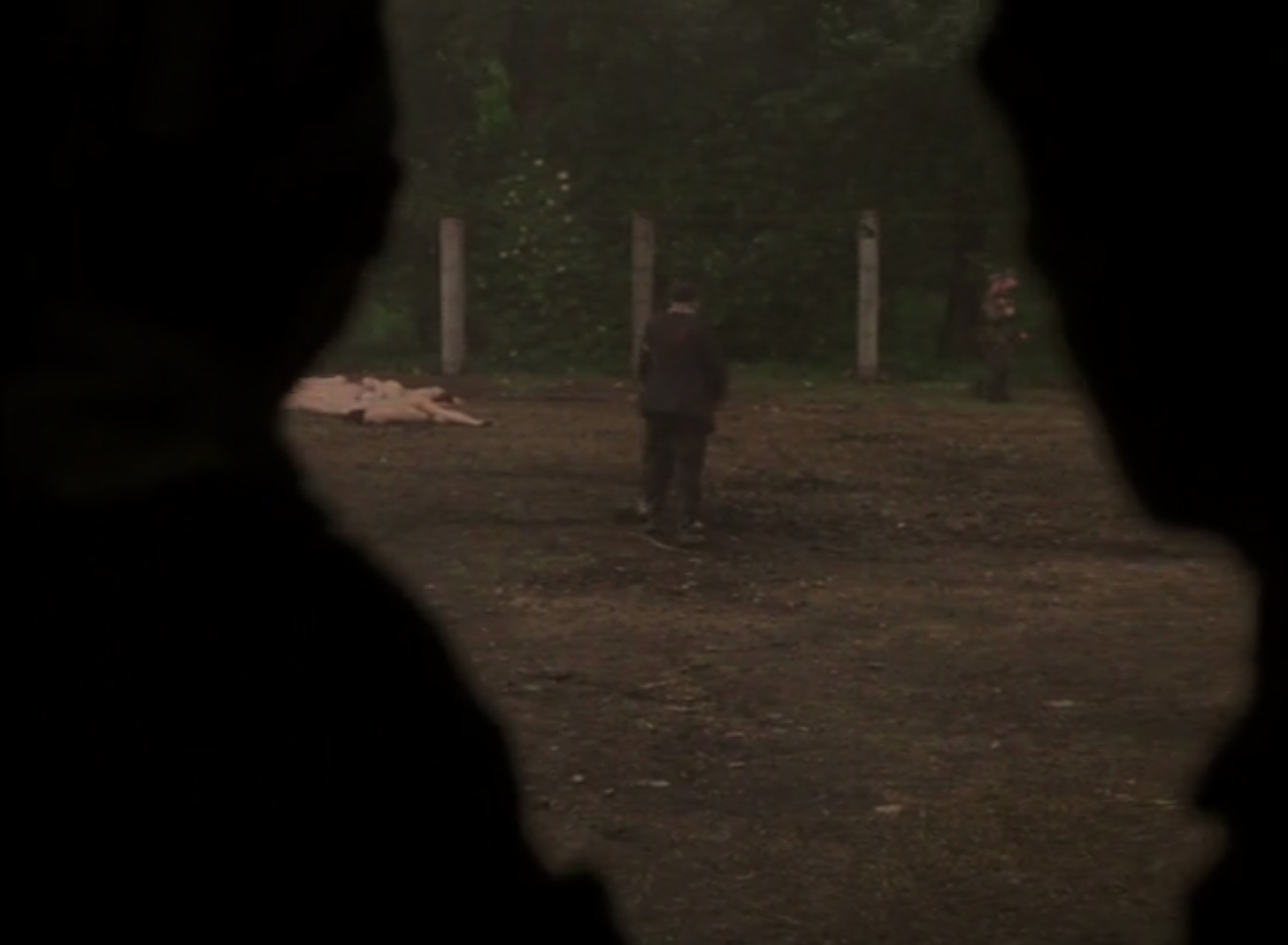 Fig. 1: Son of Saul creates new depths of field with its blurred staging of atrocities, such as in this scene where silhouetted members of the Sonderkommando surreptitiously try to take photos documenting these crimes.