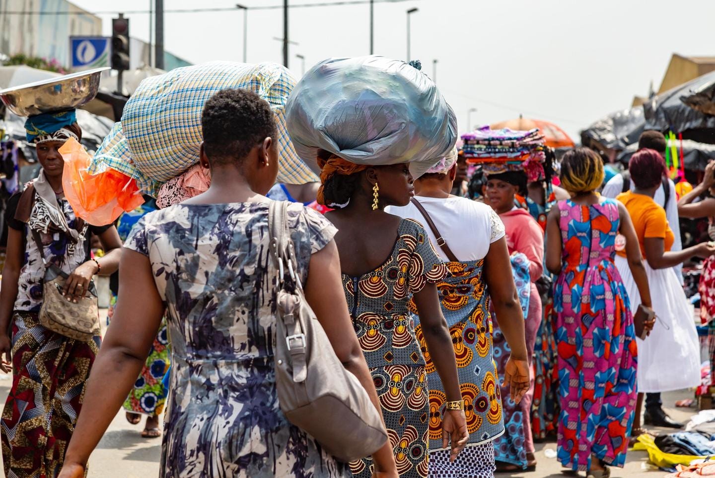 Women in Africa walking along the streets of a market 
