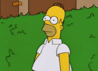 Homer Simpson backs into a green hedge and disappears.