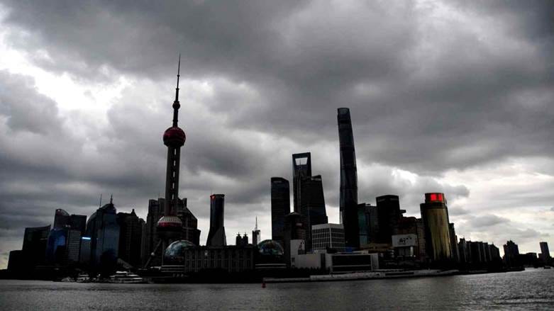 A city skyline with dark clouds

Description automatically generated