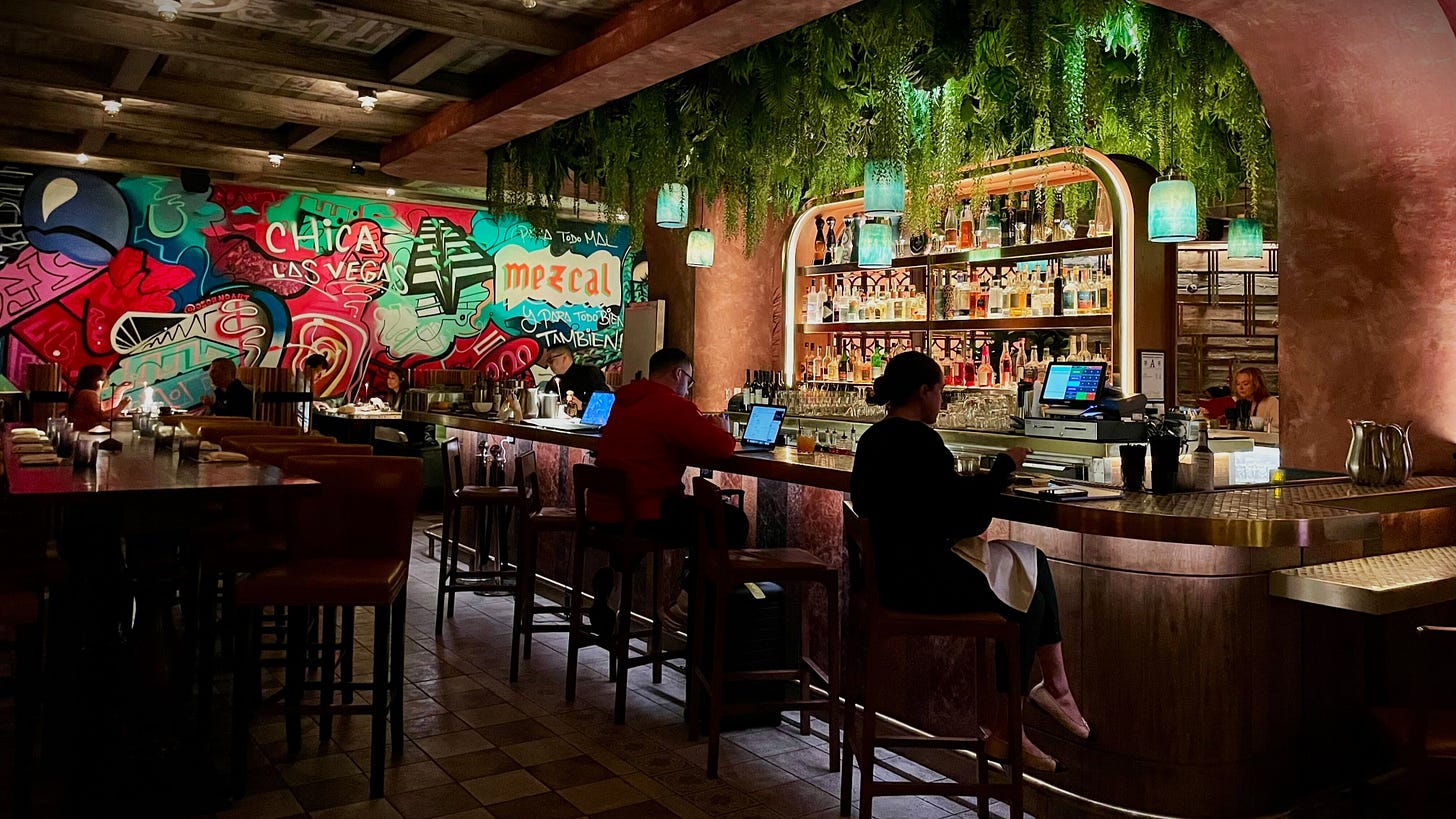 The interior of Chica Las Vegas Featuring Hand Painted Murals and a beautiful bar