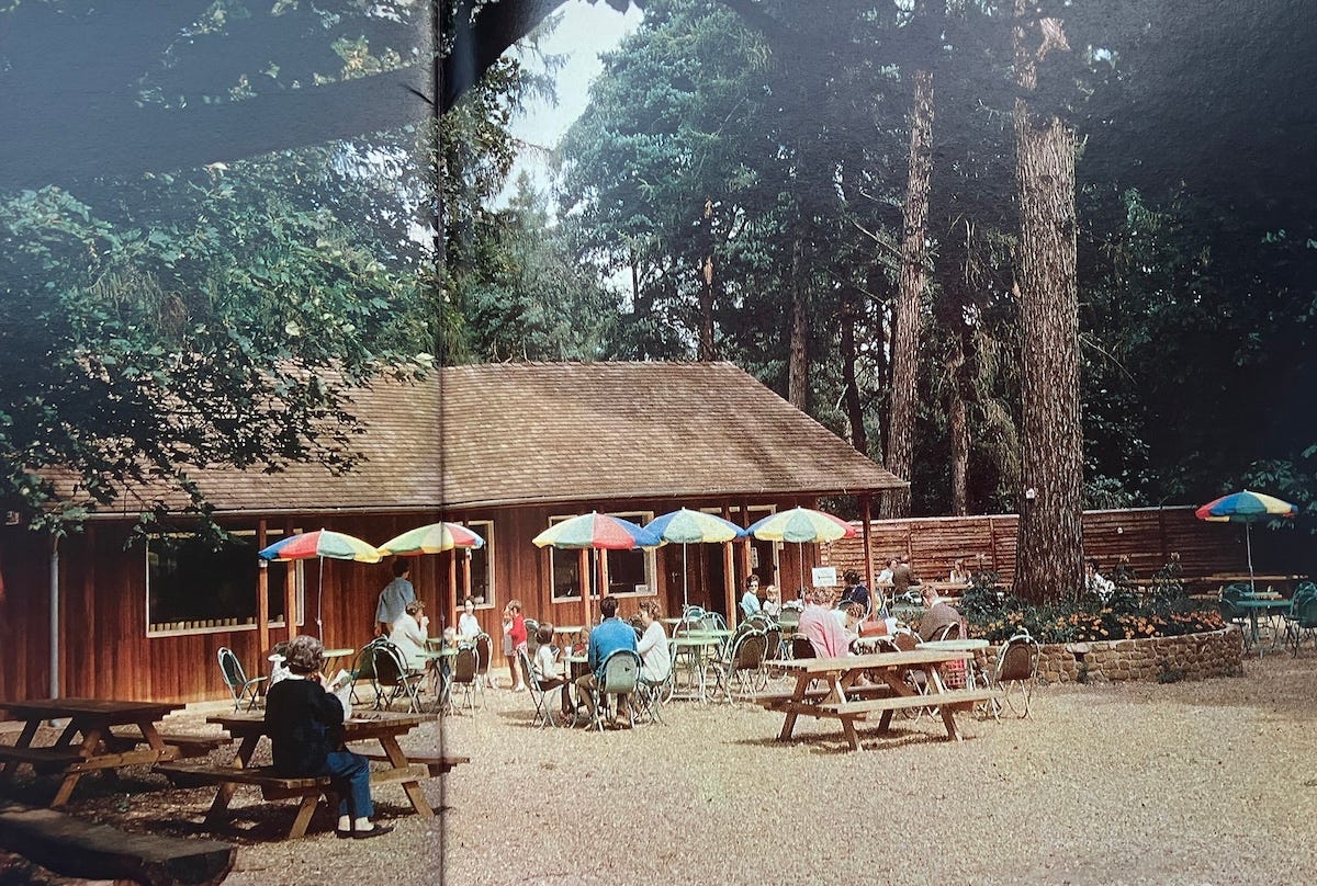 Picture of a low, wooden building which housed the cafeteria in the 1970s
