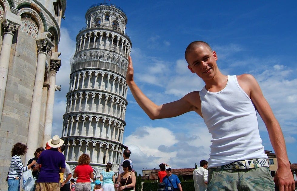20 Ridiculous Shots of Tourists "Holding Up" Pisa's Leaning Tower