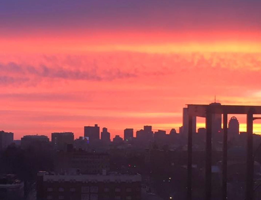 A purple and pink sunrise over Boston, Massachusetts.