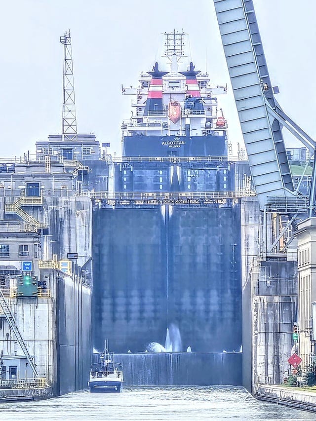 r/GreatLakesShipping - Trusting the technology with an interesting point of view. Big boat, little boat - ALGOTITAN up in Lock 6 with a smaller craft waiting to enter Lock 4 in the Welland Canal. Photo Amy Daggett June 19, 2024