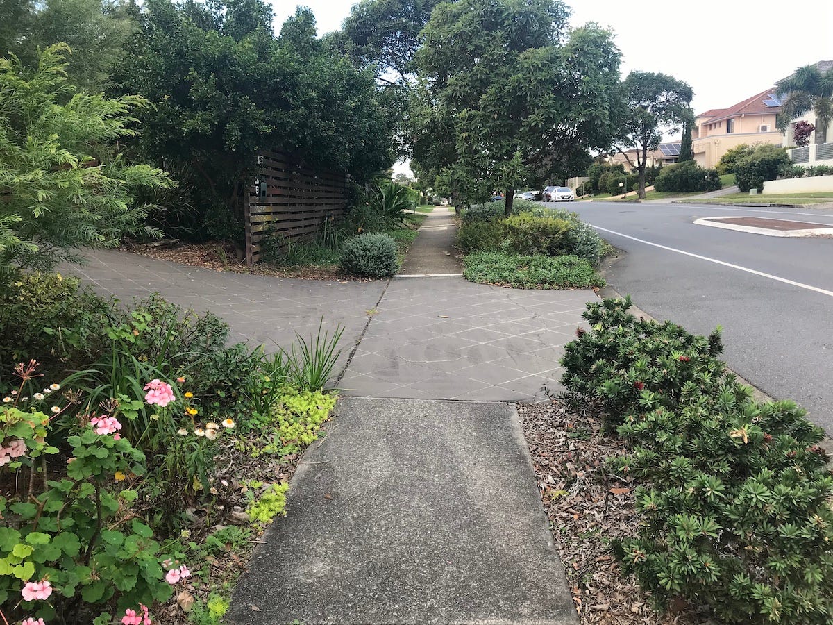 long view of a street through verge gardens